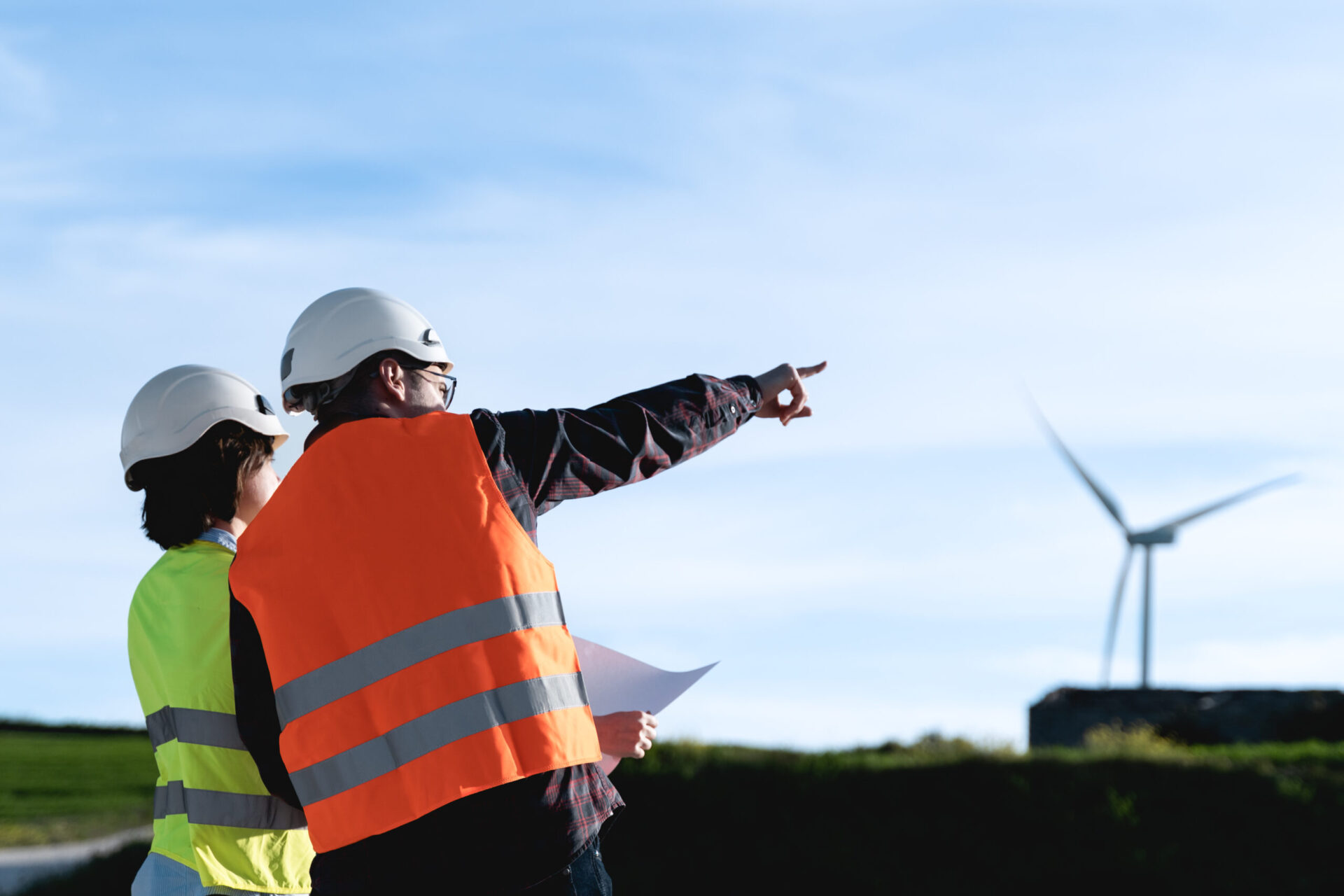 Engineer working at alternative renewable wind energy farm Sustainable energy industry concept